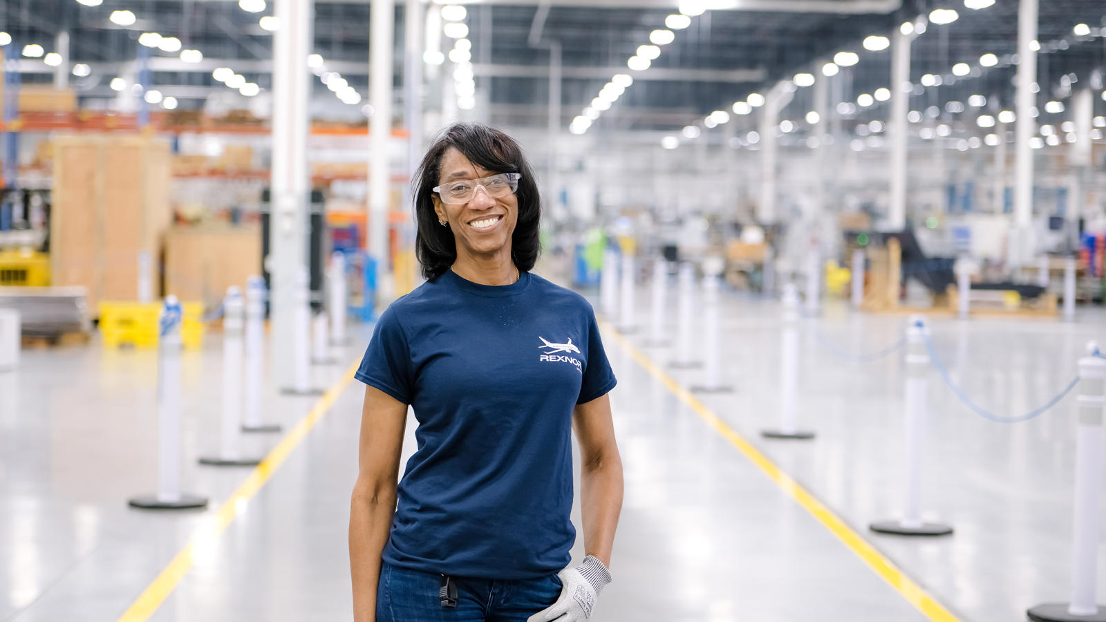 a person wearing gloves and a blue shirt