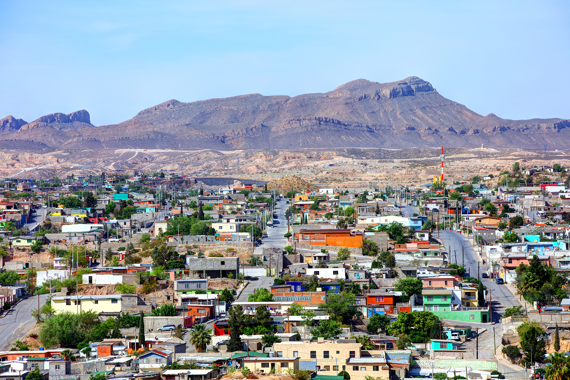 a city with a mountain in the background