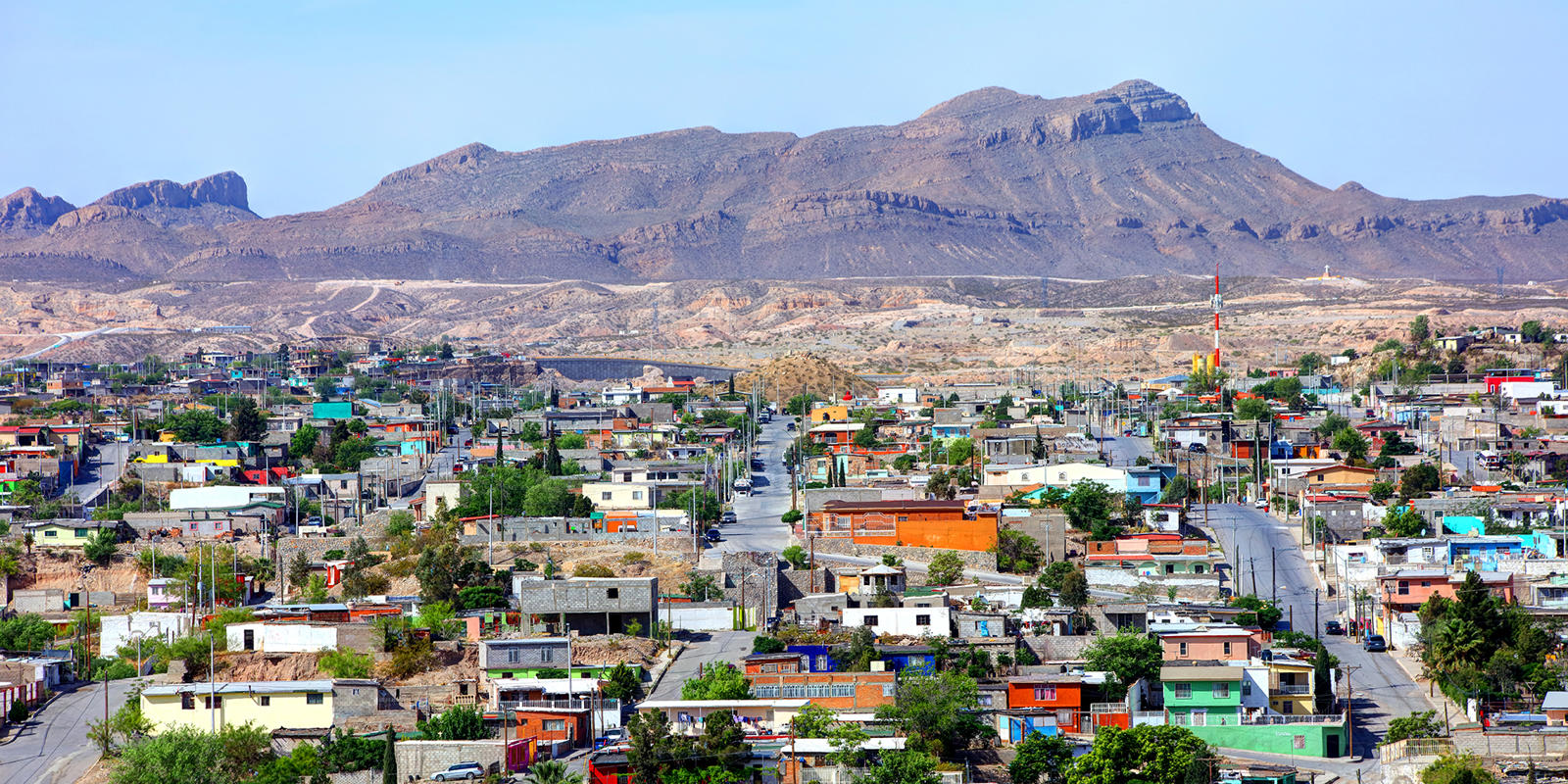 a city with a mountain in the background