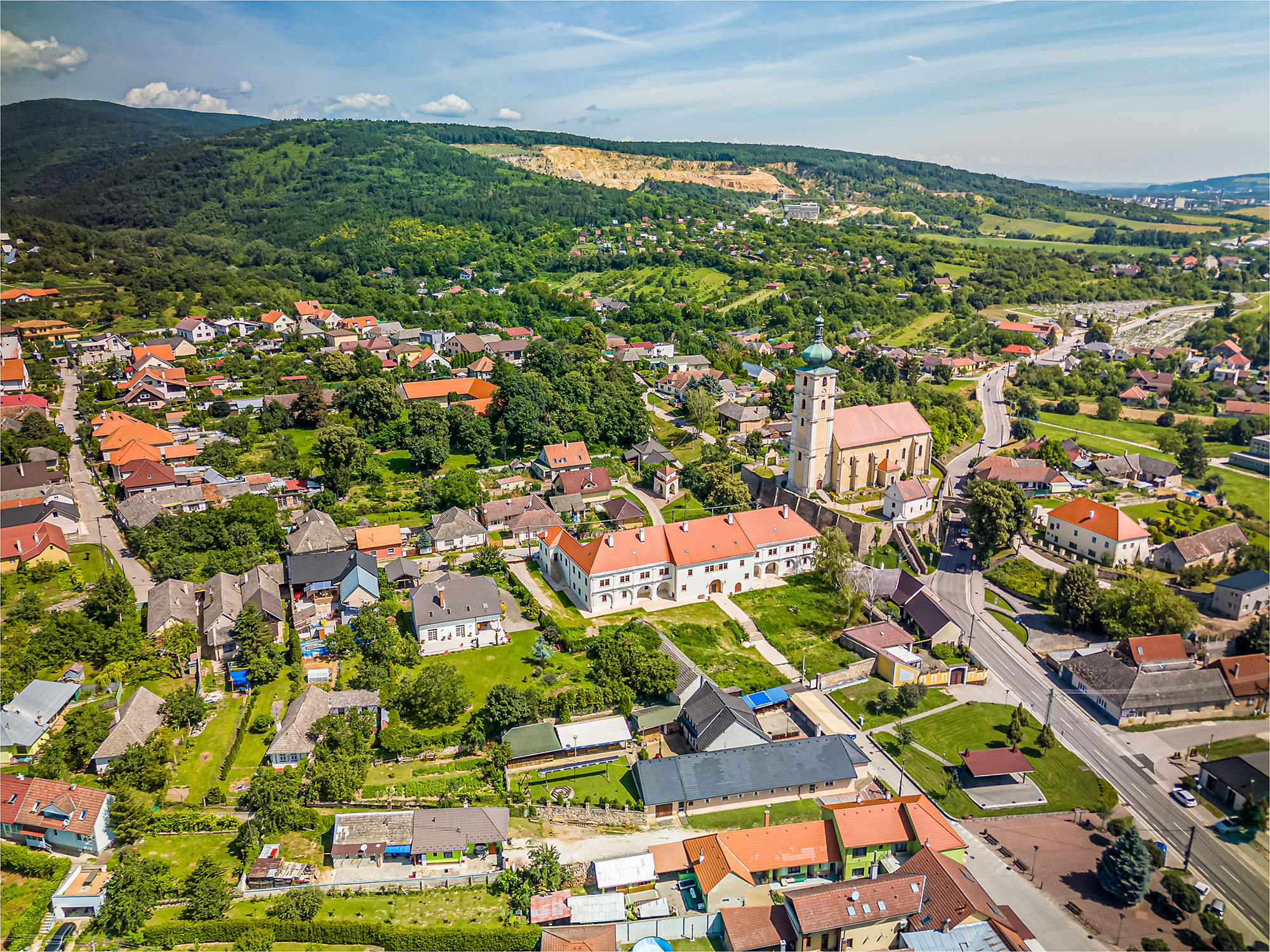 a town with a church and trees