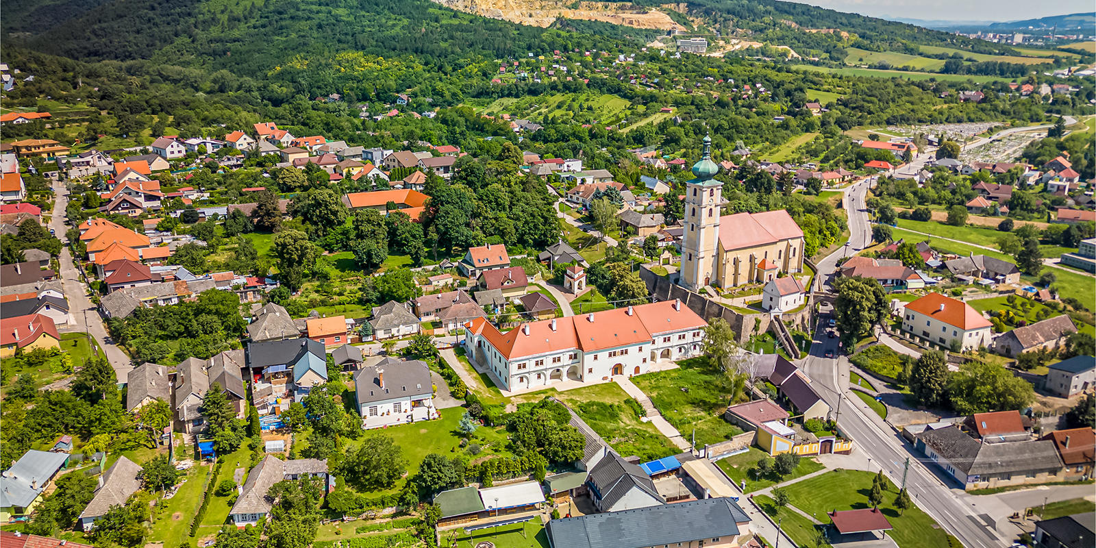 a town with a church and trees