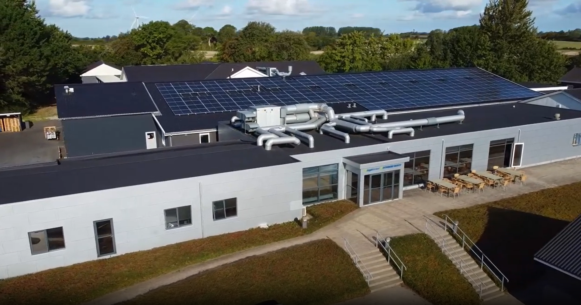 a building with solar panels on the roof