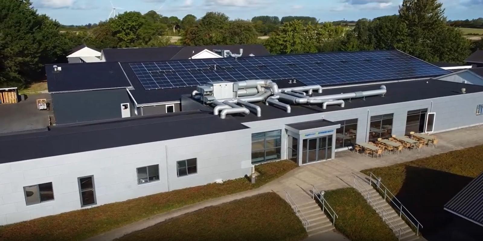 a building with solar panels on the roof