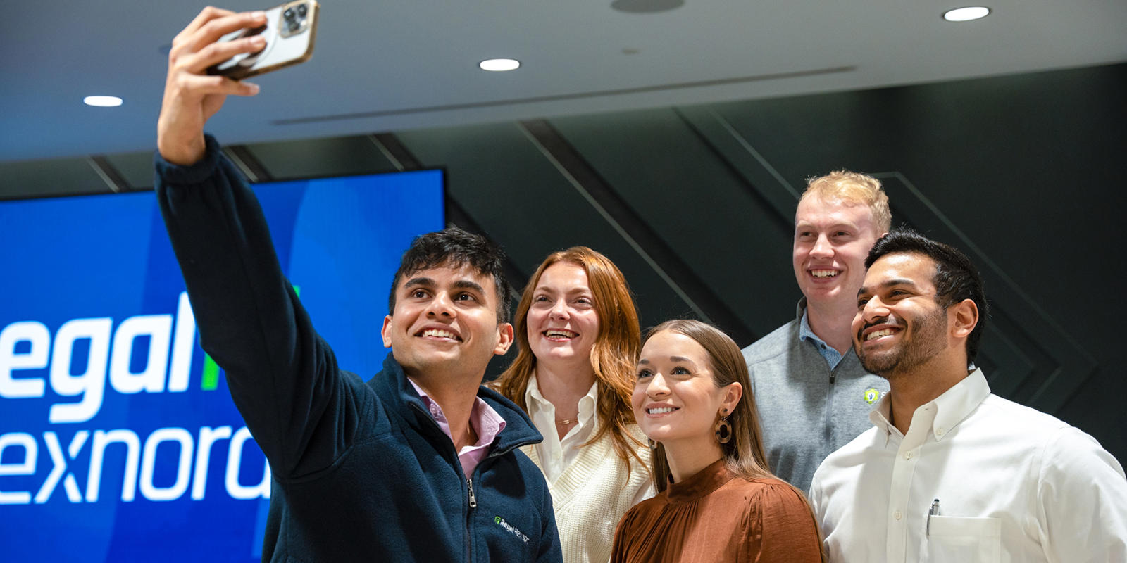 a group of people taking a selfie