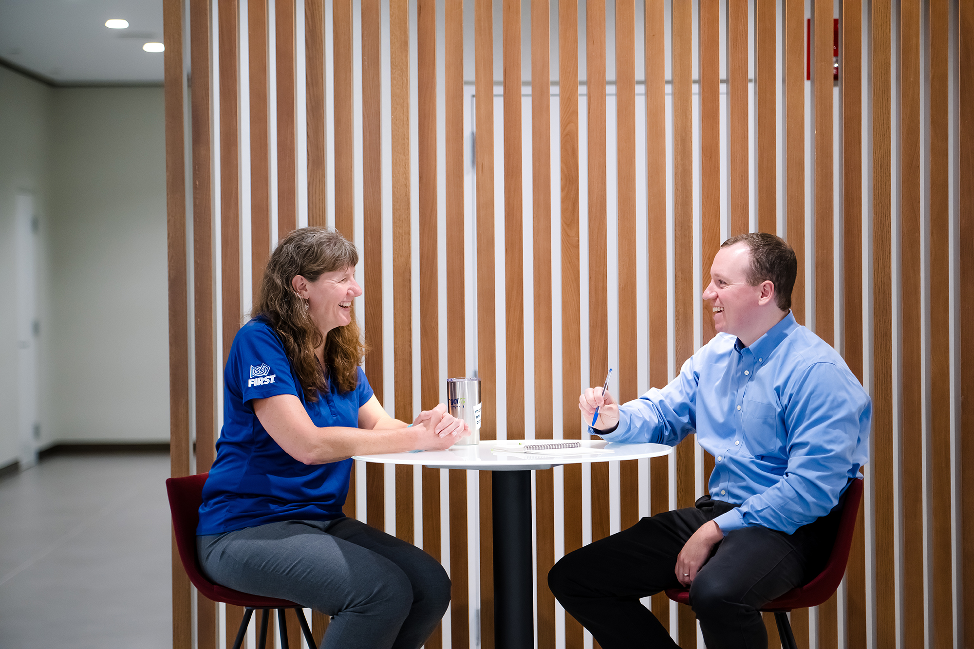 a person and person sitting at a table
