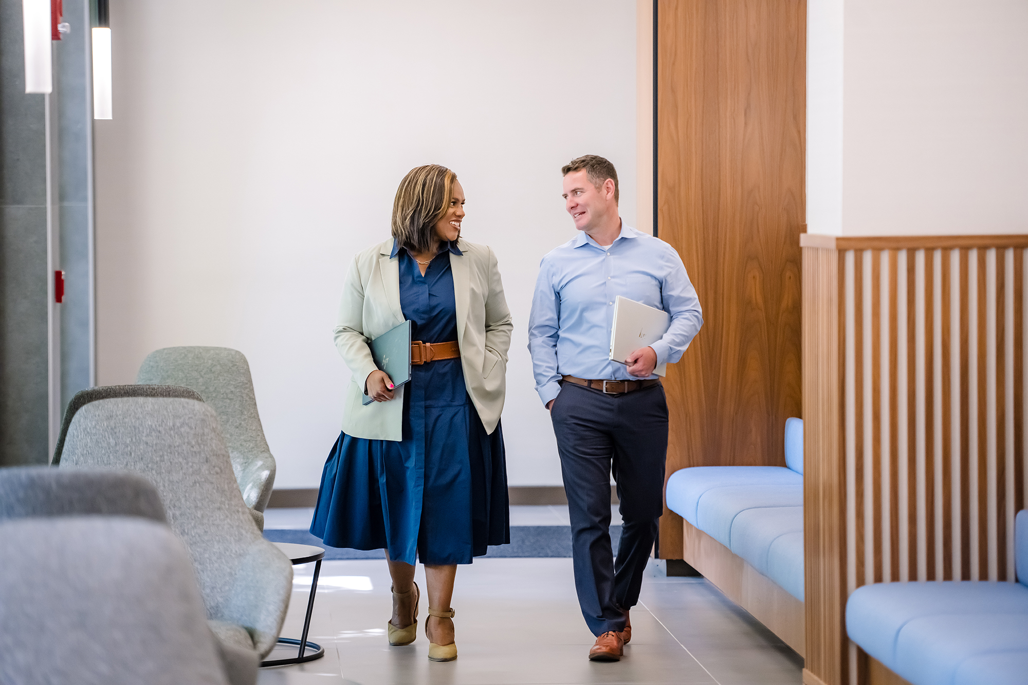 a person and person walking in a room