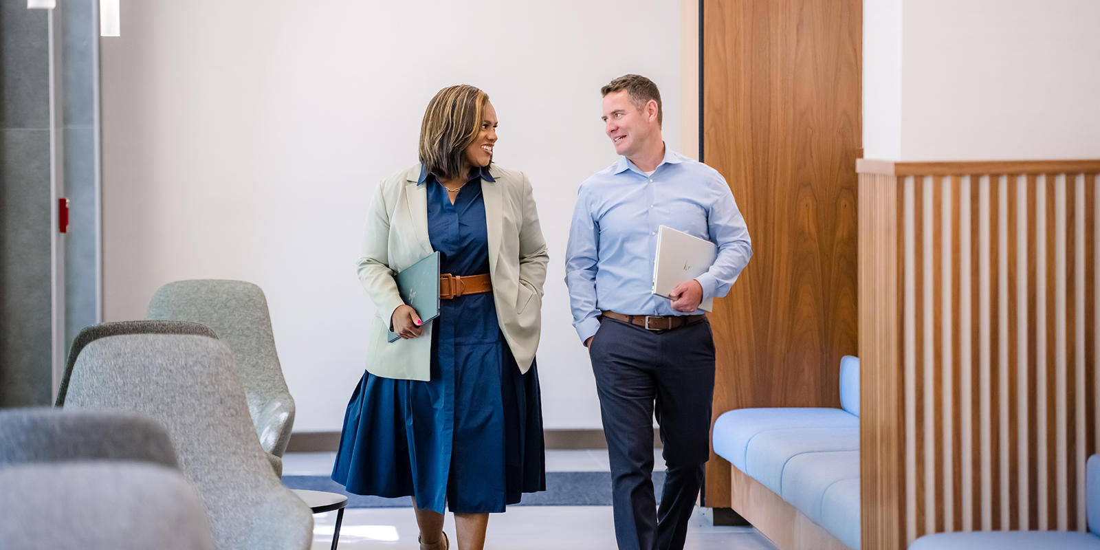 a person and person walking in a room